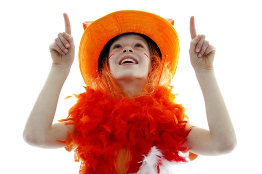 portrait of a young girl as soccer supporter is pointing over white background