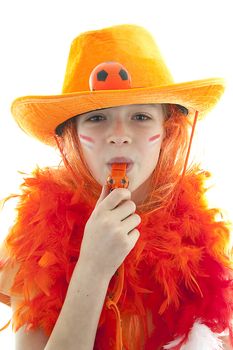Happy soccer supporter: young blonde girl in orange outfit blow on flute