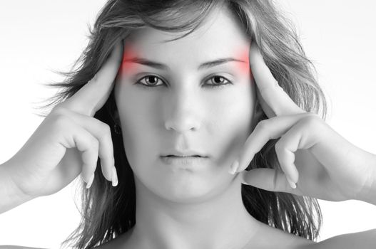 Woman suffering from an headache, holding her hands to the head