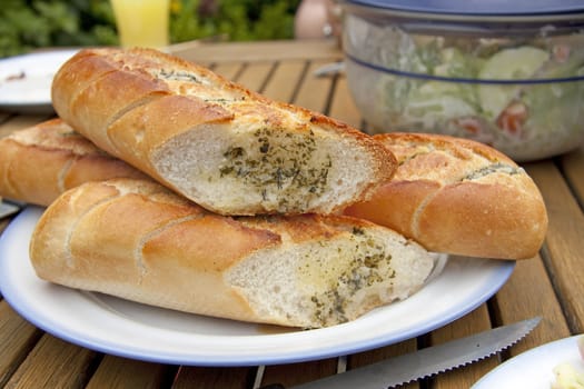 Baguette with herb butter in closeup