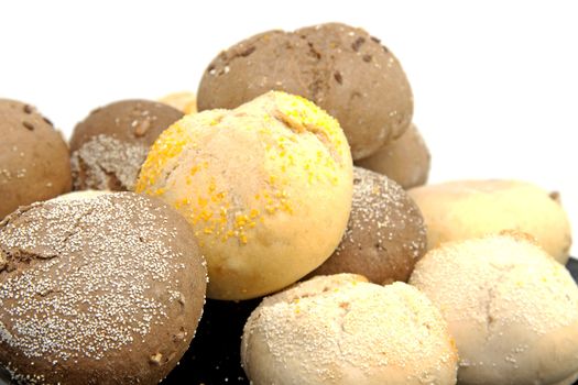 Stack of fresh baked buns over white background