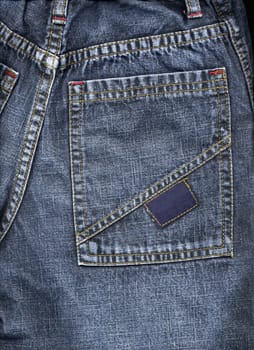 Colose up of blue jeans pocket.