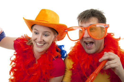 Two Dutch soccer fans in orange outfit cheering for the WK games, over white background