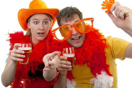 Two Dutch soccer fans in orange outfit cheering for the WK games, over white background