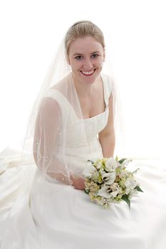 Young beautiful bride with bouquet is smiling over white background