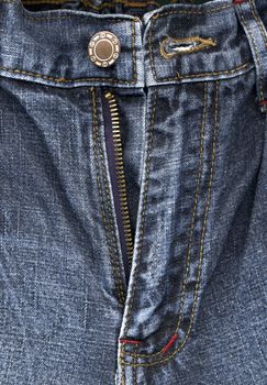 Detail of zipper on blue jeans close up