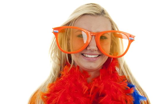 portrait of Dutch soccer fan in orange outfit with big glasses over white background