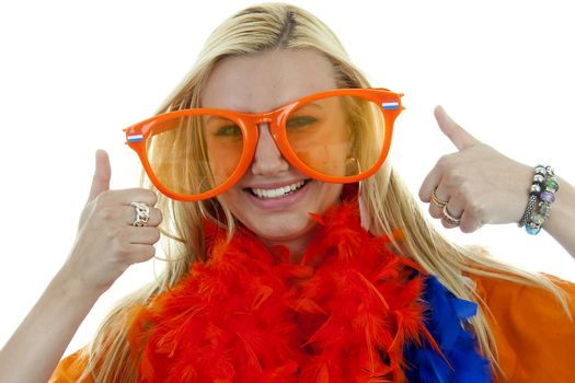 portrait of Dutch soccer fan in orange outfit with big glasses and thumbs up over white background