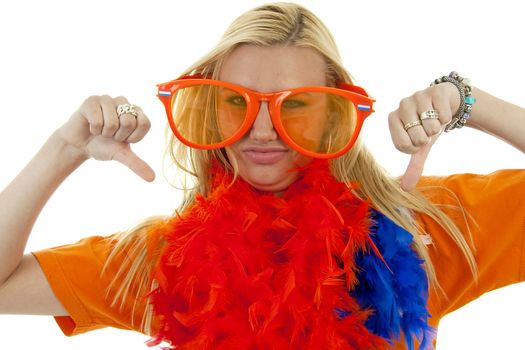 portrait of Dutch soccer fan in orange outfit with big glasses and thumbs down over white background