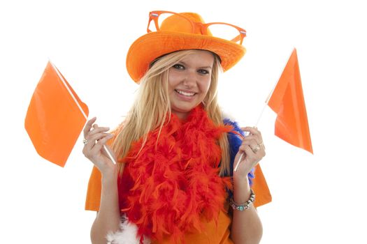 portrait of Dutch soccer fan in orange outfit with flags over white background