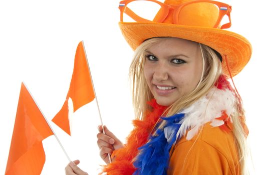 portrait of Dutch soccer fan in orange outfit with flags over white background