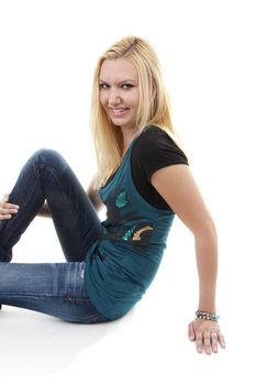 Young blonde woman is posing over white background