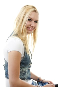 Young blonde woman is posing over white background