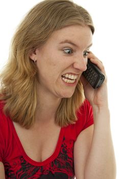 Young woman is angry on the phone over white background