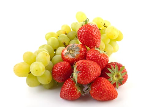 Fresh fruits: strawberries and grapes over white background