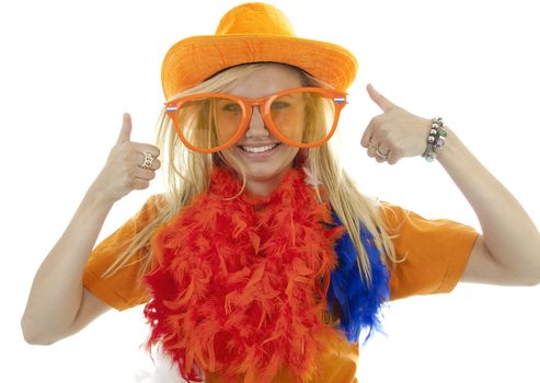 Portrait of Dutch soccer fan in orange outfit with big funny glasses and thumbs up posing over white background