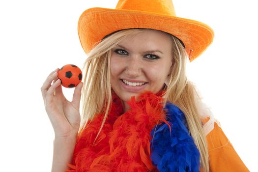 Portrait of Dutch soccer fan in orange outfit posing over white background holding ball