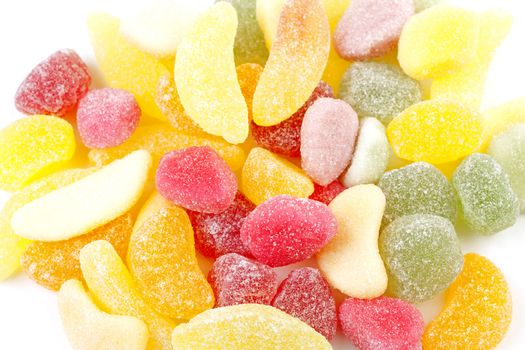 colorful sugar candy in closeup over white background