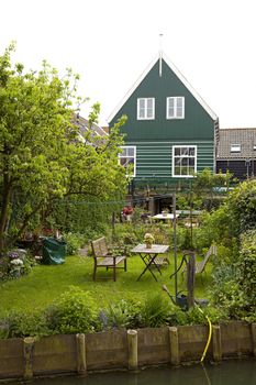 Typical Dutch houses with gardens in village Marken, Netherlands