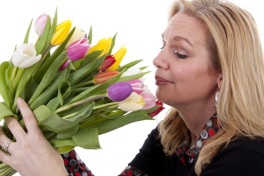 Woman with Dutch tulip flowers over white background