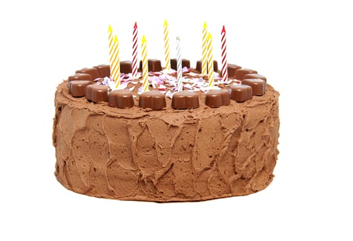 chocolate birthday cake with candles isolated on white background