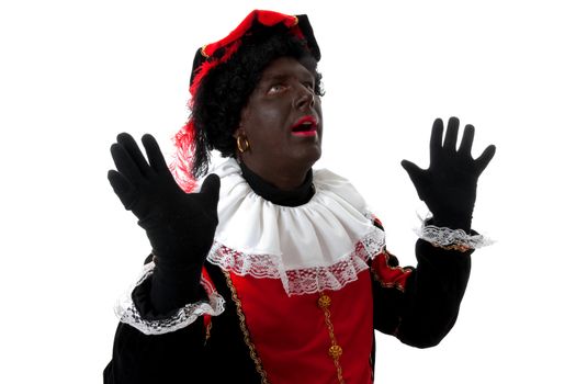 surprised Zwarte piet ( black pete) typical Dutch character part of a traditional event celebrating the birthday of  Sinterklaas in december over white background