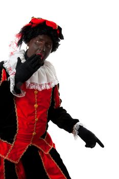 surprised Zwarte piet ( black pete) typical Dutch character part of a traditional event celebrating the birthday of  Sinterklaas in december over white background is pointing