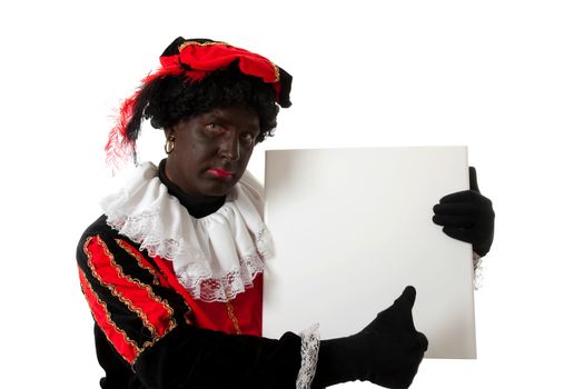 Zwarte piet ( black pete) typical Dutch character part of a traditional event celebrating the birthday of  Sinterklaas in december over white background is holding empty text board with thumb up
