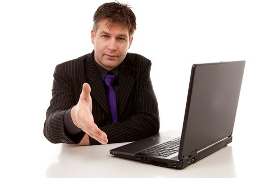 business man at work is shaking your hand, over white background