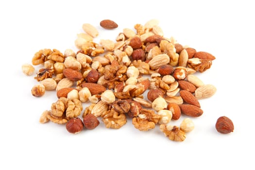 pile of raw mixed nuts isolated on white background