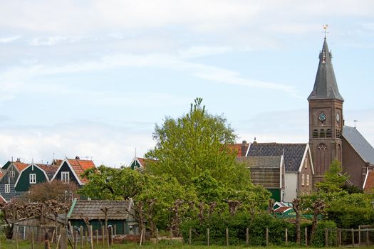 typical view of Dutch houses and church of the village Marken
