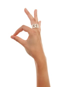 Woman's hand making OK sign over white background