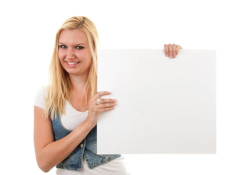 Young blonde woman is holding empty text board over white background