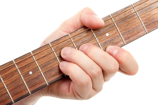 hand is playing the guitar in closeup over white background