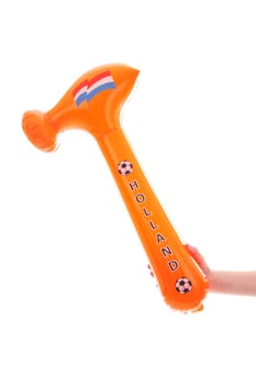 Hand with blown up orange hammer isolated on white background