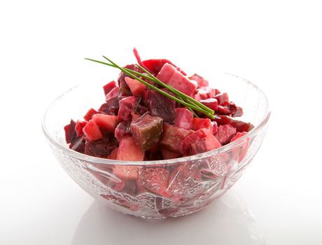 Bowl with beet salad isolated on white background