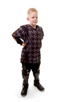 Young motor race boy is posing over white background