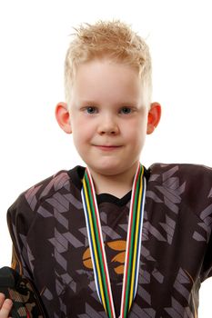 Little blonde boy looking in camera over white background