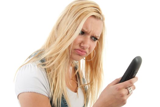 Young blonde woman is angry on the telephone, isolated on white background