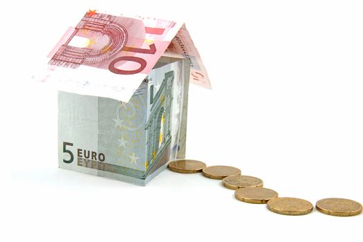 House made out of euro money over white background