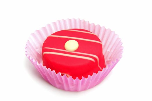 delicious pink petit four over white background