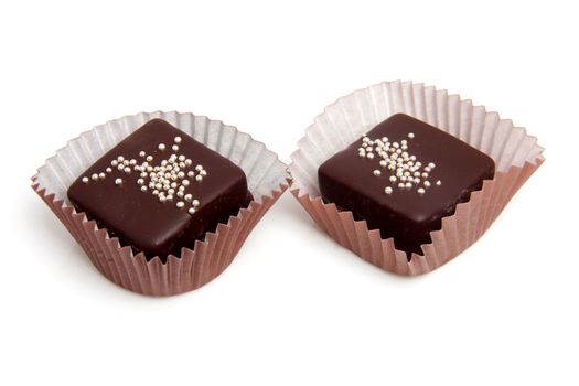 delicious chocolate petit four over white background