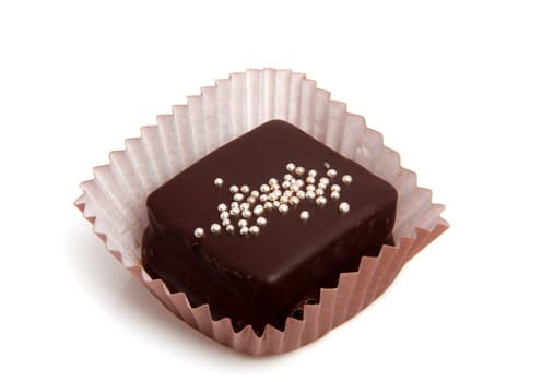 delicious chocolate petit four over white background