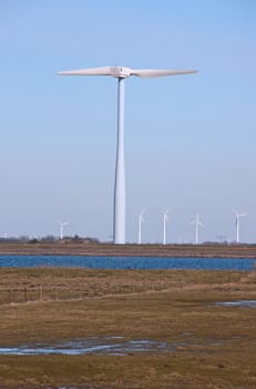 Dutch windmills in a field near zeewolde