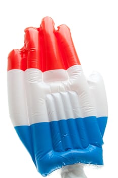 Big blown up hand with the Dutch flag over white background