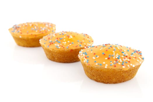 Big orange cake cookies for Dutch soccer with confetti over white background