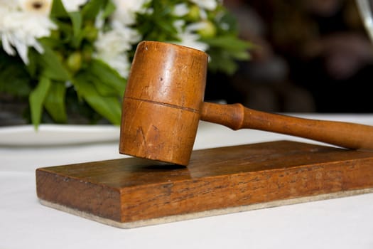 old wooden gavel in closeup used by wedding