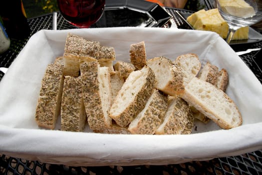 Bread with herbs in basket for barbecue