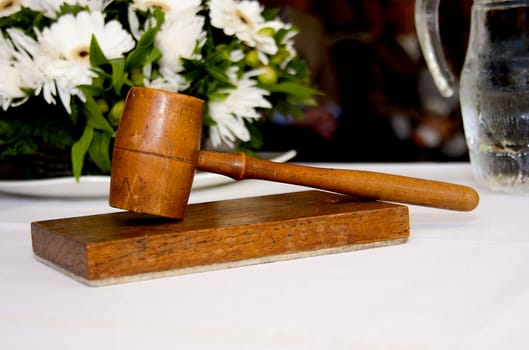 old wooden gavel in closeup used by wedding