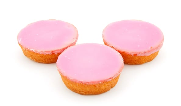 Three pink glazed cookies isolated on white background